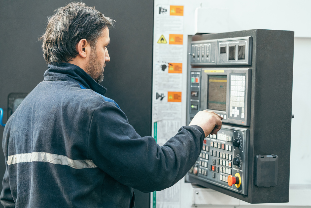 Man working at programmable machine