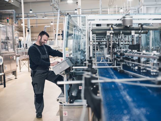 Worker operating a machine